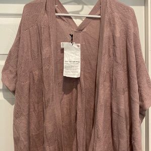 Lululemon wrap in light dusty pink/purple. One size fits most. NWT